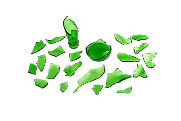 istock broken glass green, broken glass isolated on white background 939754226
