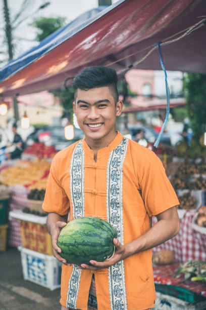 istock Thai farmer selling watermelons on market 939754778