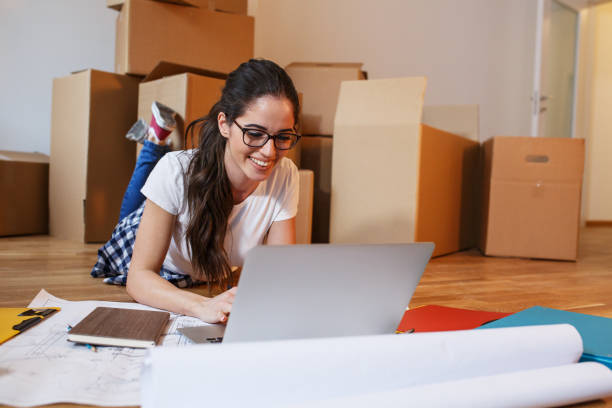 istock Young woman moving into a new house. 939757958