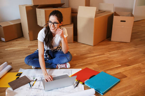 istock Young woman moving into a new house. 939758092
