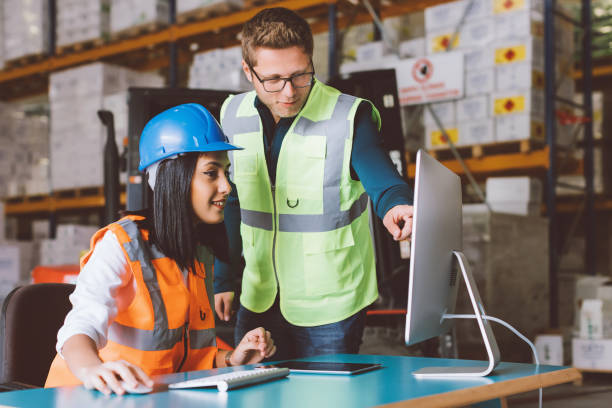 istock Business colleagues working with tablet computer in warehouse 939762778