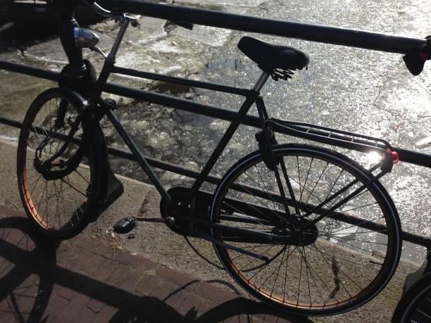 istock Amsterdam bicycle on a canal bridge 939783458