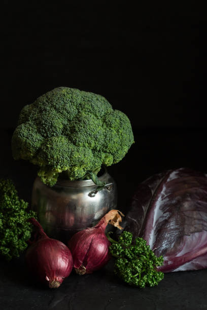 istock Still life of raw vegetables on a dark background 939784982