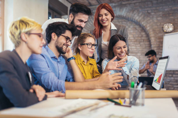 istock Business people working in office together. Team work in office. 939787118