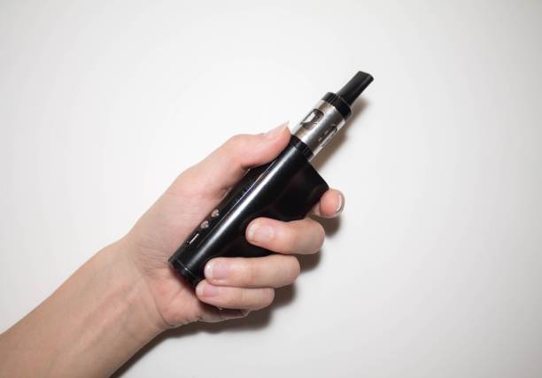 istock electronic vaporizer in hand on white background 939787368