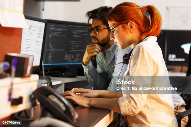 Two Programmers Working On New Projectthey Working Late At Night At The Office Stock Photo - Download Image Now