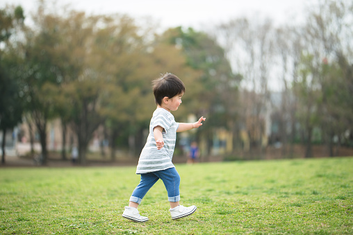 Portrait of child walking in park
