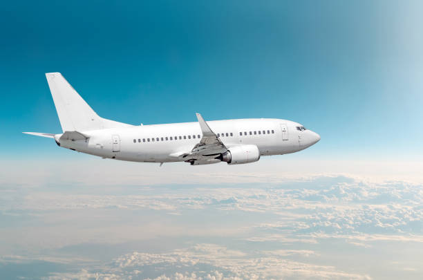 istock Passenger airplane fly on a hight above overcast clouds and blue sky. 939795198