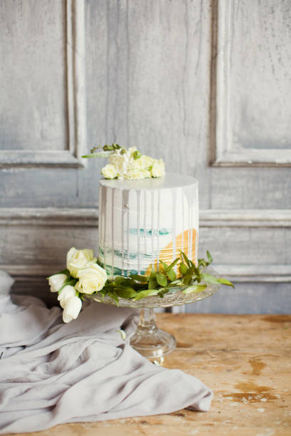 istock wedding cake decorated white flowers 939795390