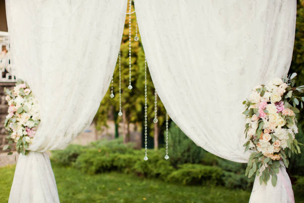 istock wedding arch with flowers and crystals 939795746