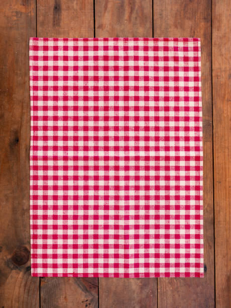 Red classic  Checkered tablecloth on wooden table, background with copy space