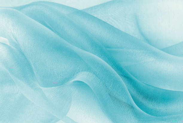 closeup of the wavy organza fabric organza fabric in blue colorcloseup of the wavy organza fabric chiffon stock pictures, royalty-free photos & images