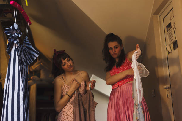 istock Two young women choosing their outfit 939800056