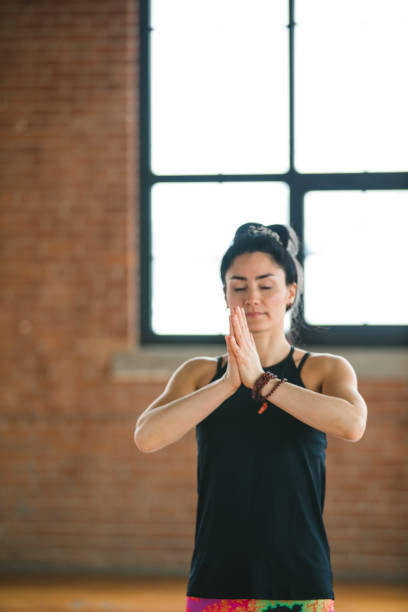 istock Woman practicing yoga. Mountain pose. Tadasana 939800824