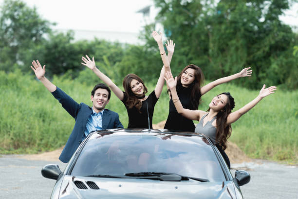 istock A Playboy having a party in his convertible car 939806800