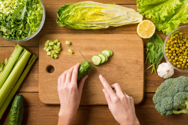 istock Prepare a salad of fresh vegetables. 939806842