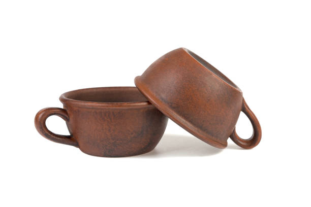 istock two clay cups one on another isolated on white background 939807666