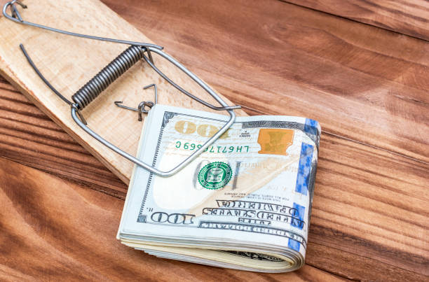 istock Mousetrap with dollar bills on the table. Top view. Business concept. 939808018