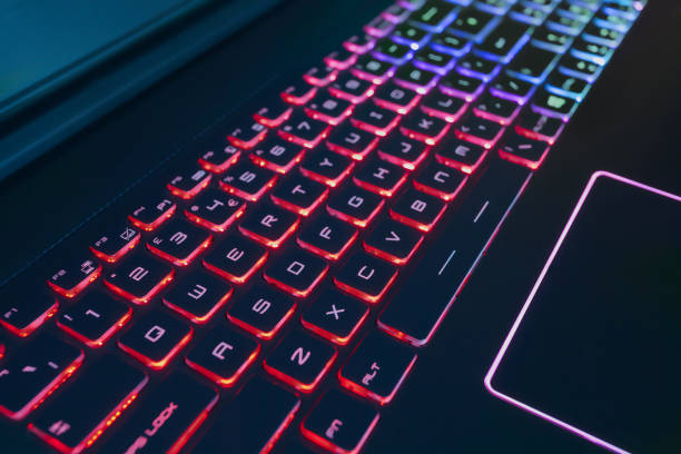 istock Expensive Laptop keyboard Back Lit in Red and Blue. 939812078