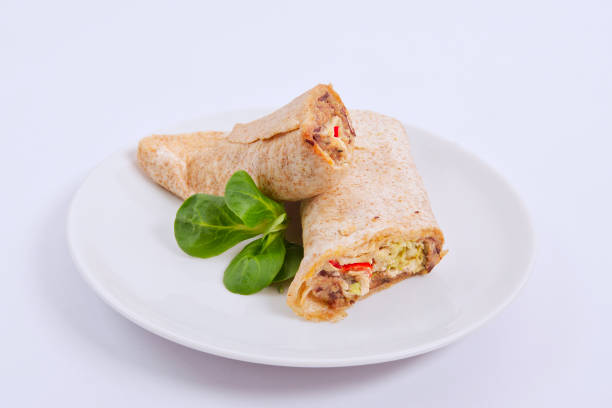 istock Tasty vegetarian tortillas on a white 939814540