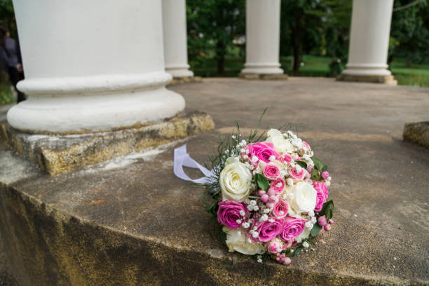 istock Romantic fresh wedding bouquet in aclove with columns 939815470