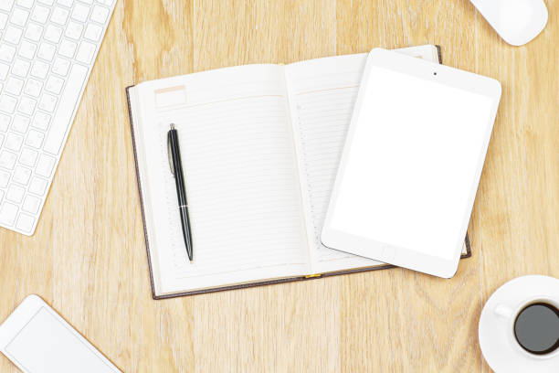istock Office desk top with tablet and supplies 939815496