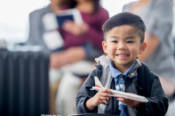 istock Happy Boy With Toy Plane 939818996