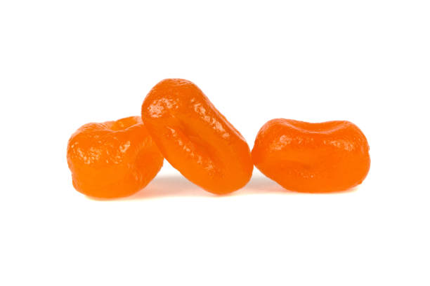 istock three orange candies isolated on white background 939819328