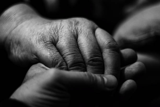istock Holding my grand mother's hand 939819856