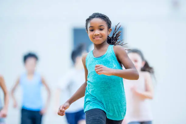 Photo of Girl running in gym