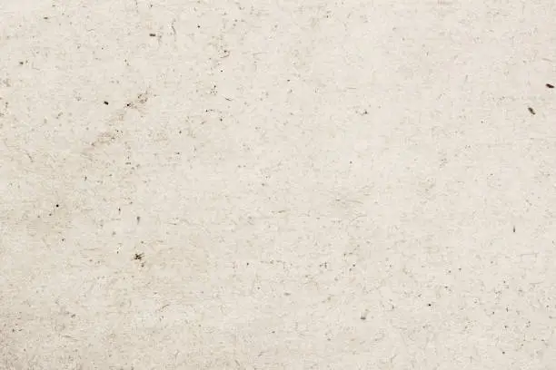 Photo of Texture of old organic light cream paper with wrinkles, background for design with copy space text, image. Recyclable material,with small inclusions of cellulose