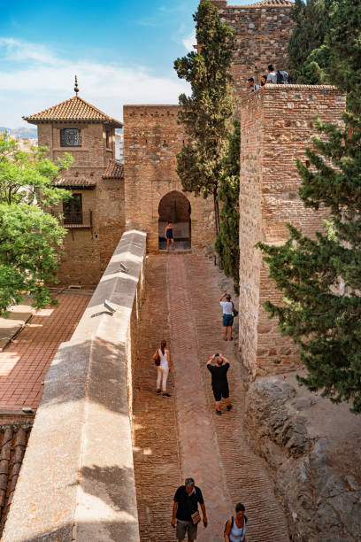Alcazaba in Malaga Andalusia Spain People visit the Alcazaba in Malaga Andalusia Spain. The Alcazaba is a fortification built by the Hammudid dynasty in the early 11th century. alcazaba of málaga stock pictures, royalty-free photos & images