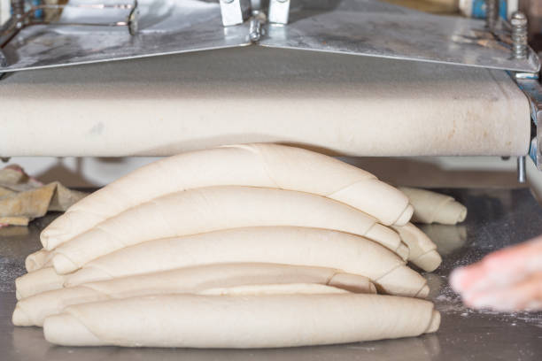 istock Several Rolled Up Baguette Dough Portions 939831006