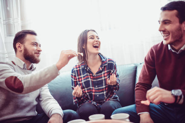 Group of Friend Eating Snacks, Conversing and Having Fun Time Together Group of Friend Eating Snacks, Conversing and Having Fun Time Together college dorm party stock pictures, royalty-free photos & images