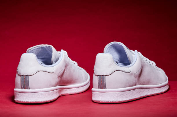 White Tennis Shoe - Red Background