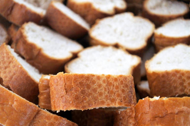 istock French bread baguette slices background 939841012