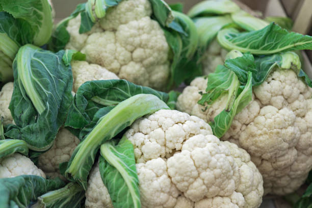 istock Cauliflower background, Group of cauliflower with green leaves 939841058