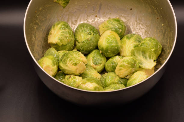 istock Seasoned Brussel Sprouts on Black 939841096