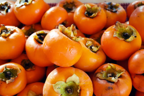 istock Freshly Picked Autumn Fruits - Persimmon 939841422
