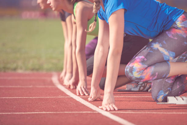istock Women ready to race on track field 939841536