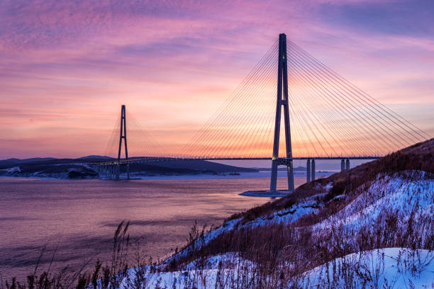 istock Winter sunset view of long cable-stayed bridge 939841812