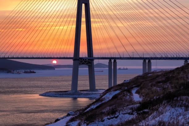 istock Winter sunset view of long cable-stayed bridge 939841814