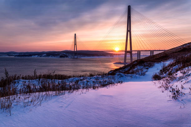 istock Winter sunset view of long cable-stayed bridge 939841818