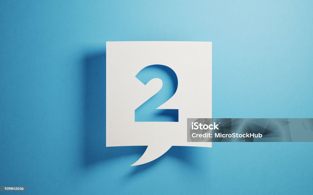 White Chat Bubble On Blue Background White chat bubble on  blue background. Number two writes on chat bubble. Horizontal composition with copy space. Number 2 Stock Photo