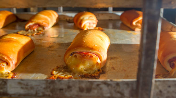 istock Ham and Cheese Rolls in the Oven 939842302