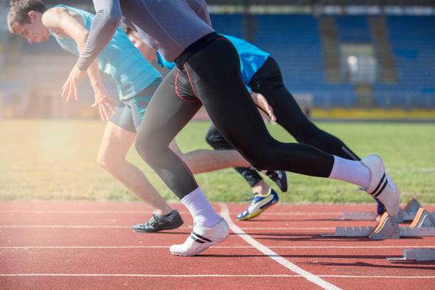 istock Athletes at the sprint start line in track and field 939842548