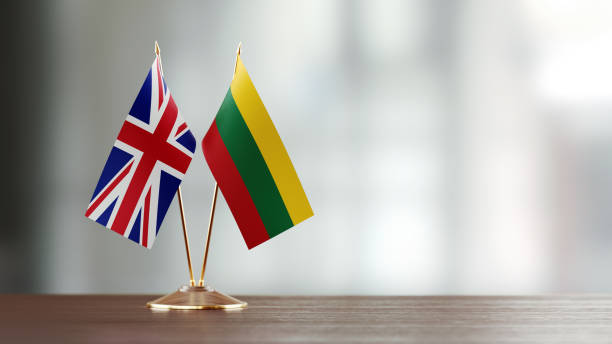 istock British And Lithuanian Flag Pair On A Desk Over Defocused Background 939845636