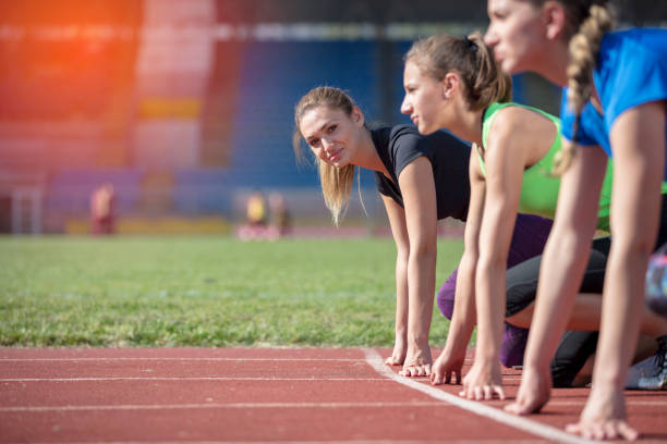 istock Women ready to race on track field 939848086