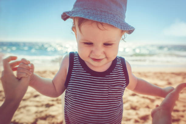 istock Baby with mother on the beach 939848646