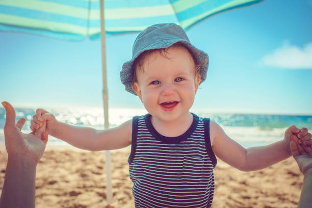 istock Baby with mother on the beach 939848648